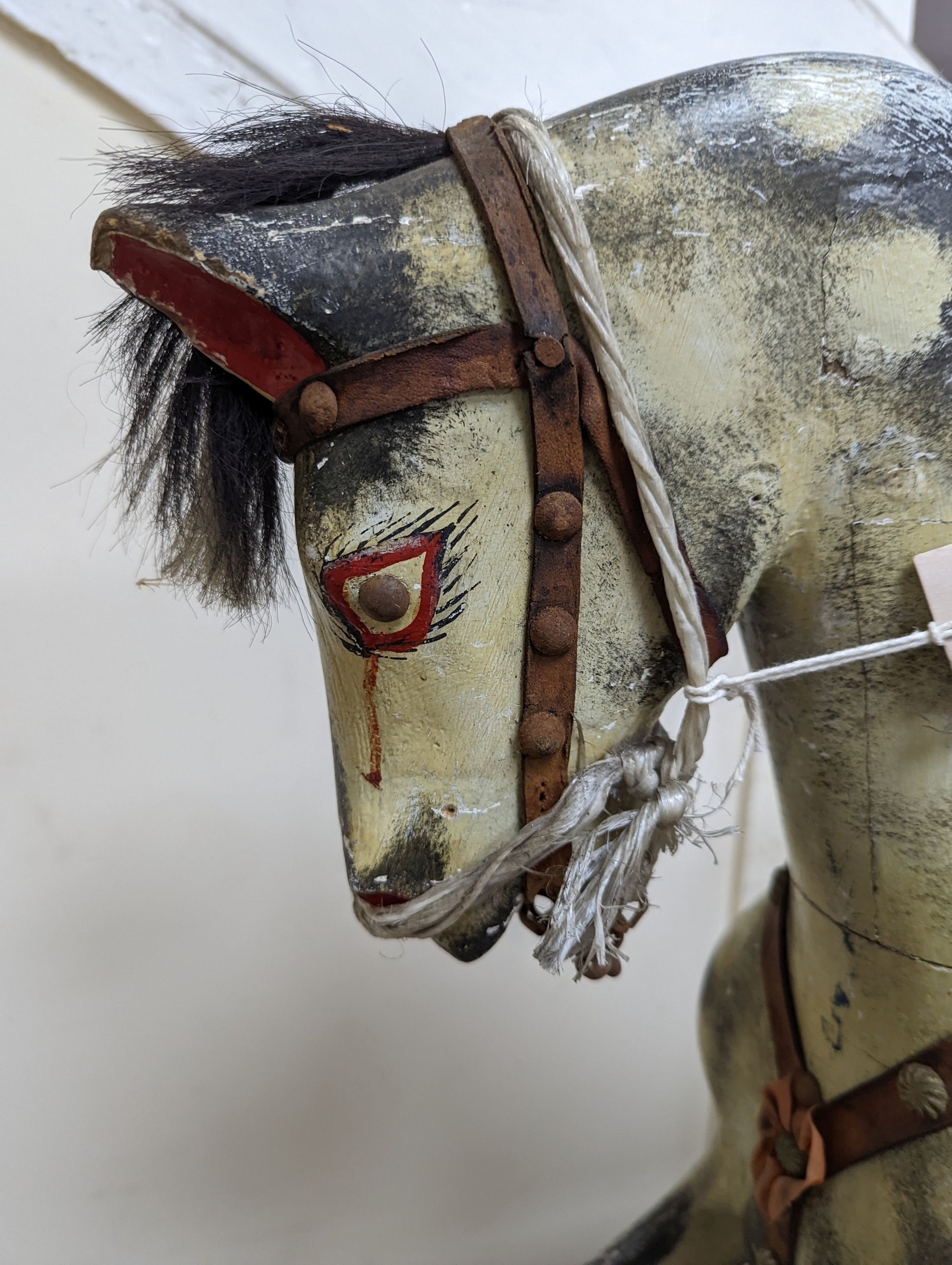 A small early 20th century Ayres type dapple grey rocking horse, length 106cm, height 87cm